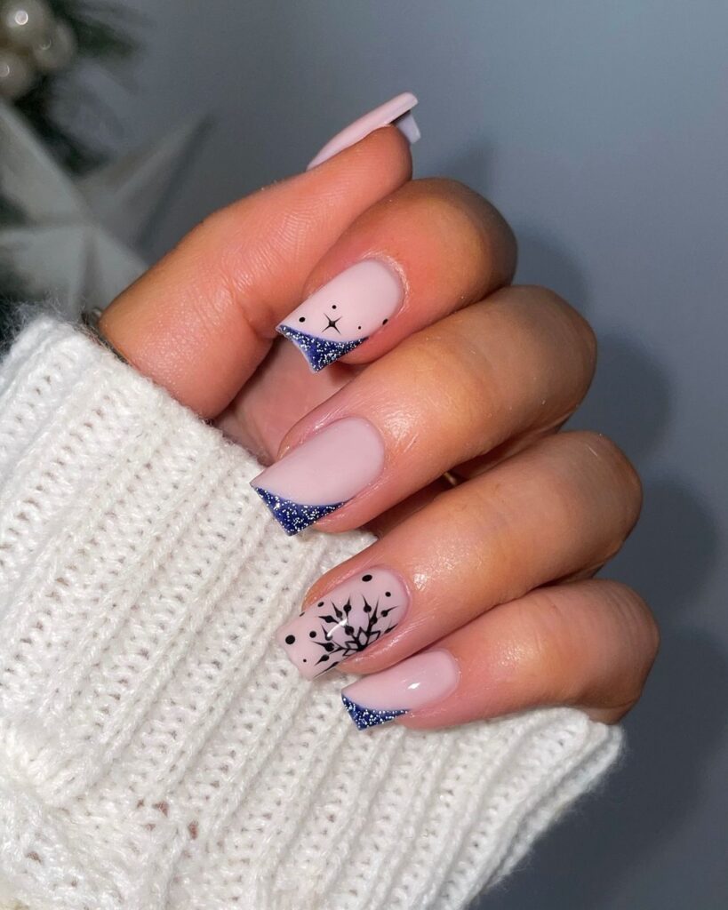 Starry skies ans snowflakes Christmas nail design